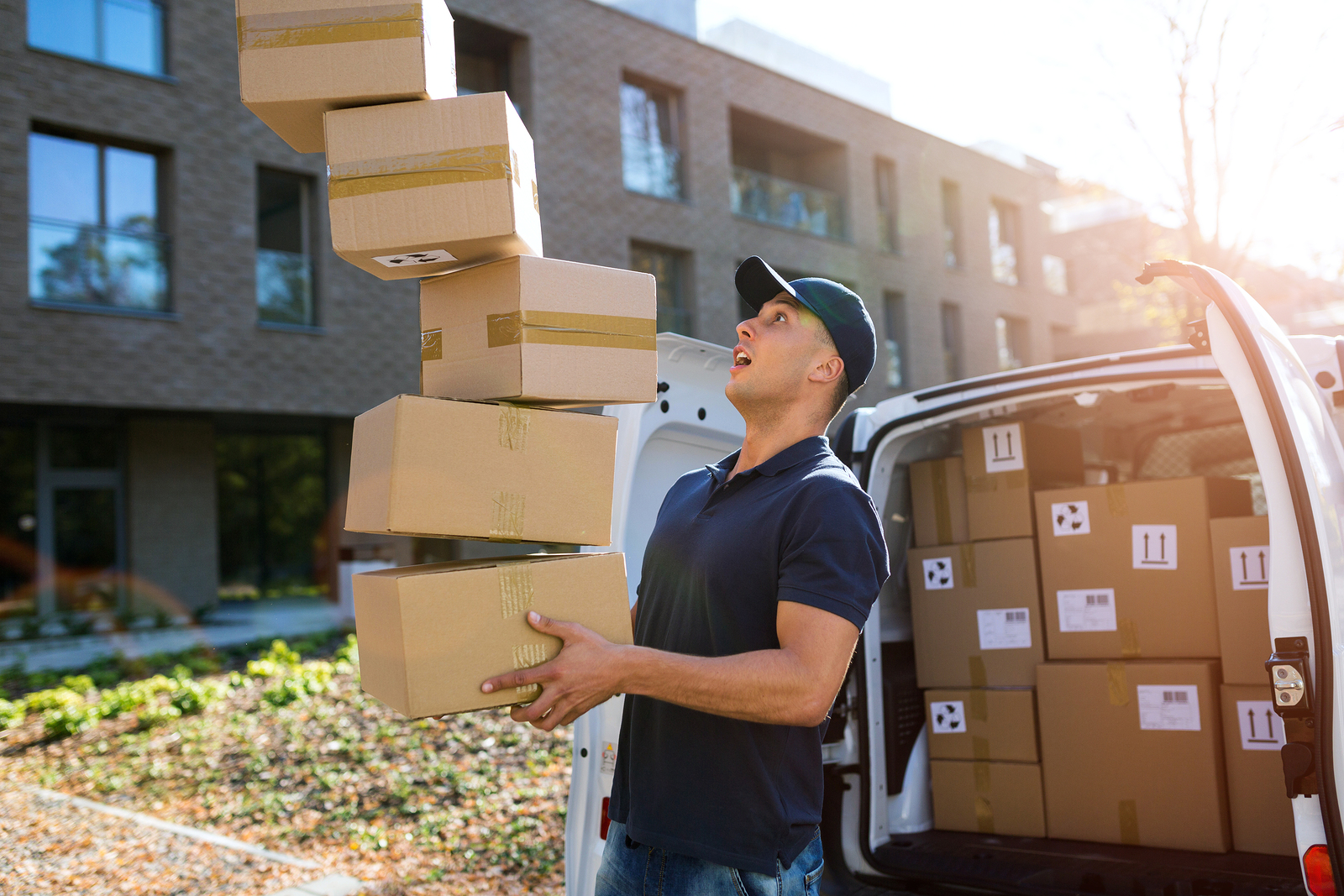 Delivery man dropping boxes